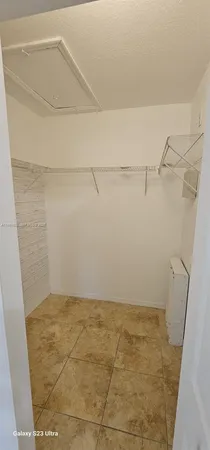 a kitchen with stainless steel appliances a refrigerator and a stove top oven