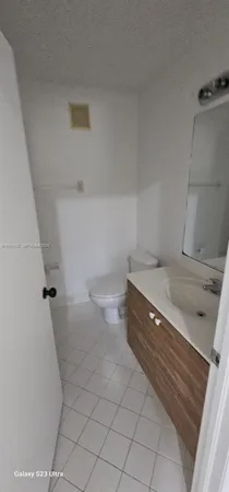 a view of an empty room and a window