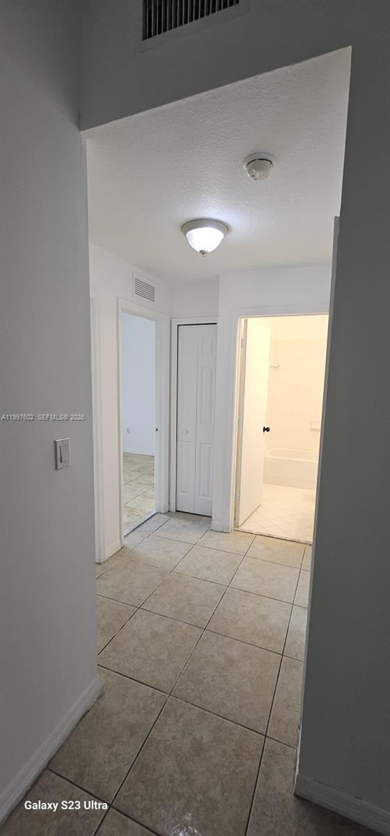 935 Northeast 33rd Terrace, Unit 204 Homestead, FL 33033 - Photo 27 of 28 a view of an empty room and a window