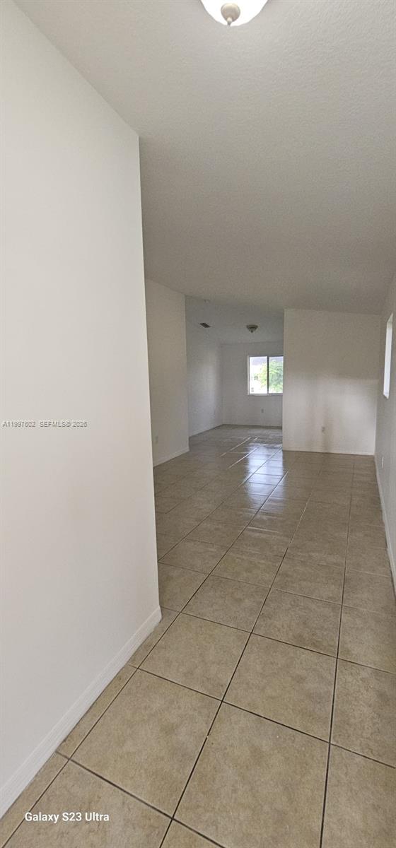 935 Northeast 33rd Terrace, Unit 204 Homestead, FL 33033 - Photo 3 of 28 a view of empty room