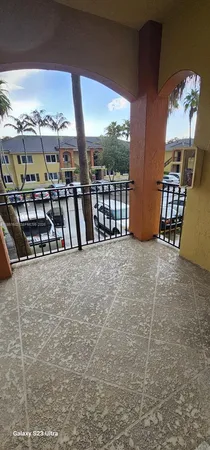 a view of balcony with outdoor seating and stairs