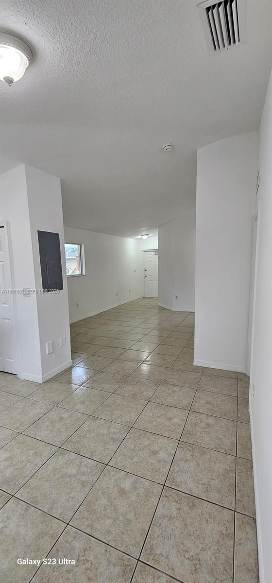 935 Northeast 33rd Terrace, Unit 204 Homestead, FL 33033 - Photo 9 of 28 a view of an empty room and window