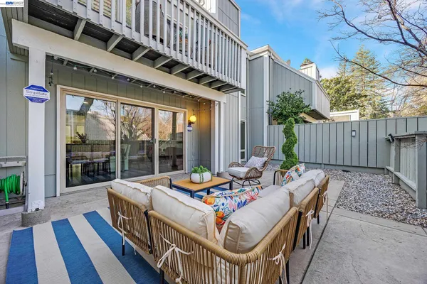 a balcony with wooden floor and fence