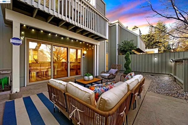 a view of a house with swimming pool and a yard