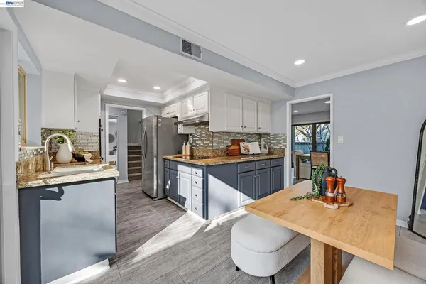 a living room with fireplace furniture and a large window