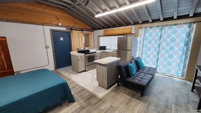 a bed room with a bed and a window