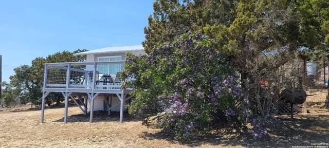 a view of a chairs and table in a patio