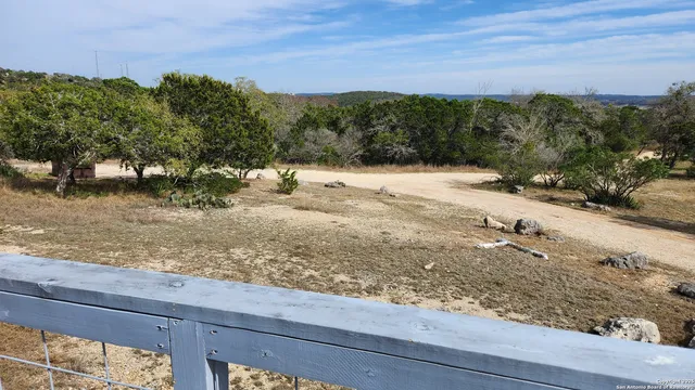 a view of a yard with a mountain