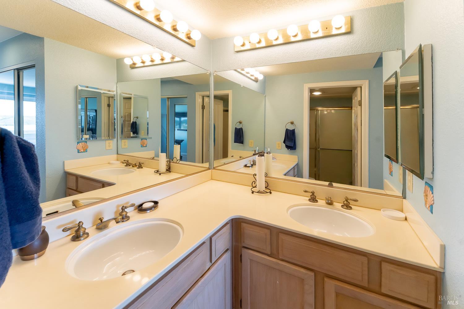 911 Point Reyes Court, Unit 6 Vallejo, CA 94591 - Photo 12 of 35 a bathroom with a sink and a mirror