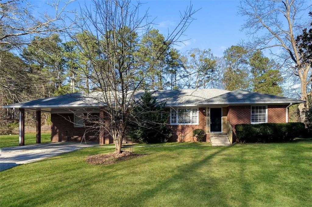 123 New Hope Road Fayetteville, GA 30214 - Photo 1 of 1 a view of a house with backyard and a tree