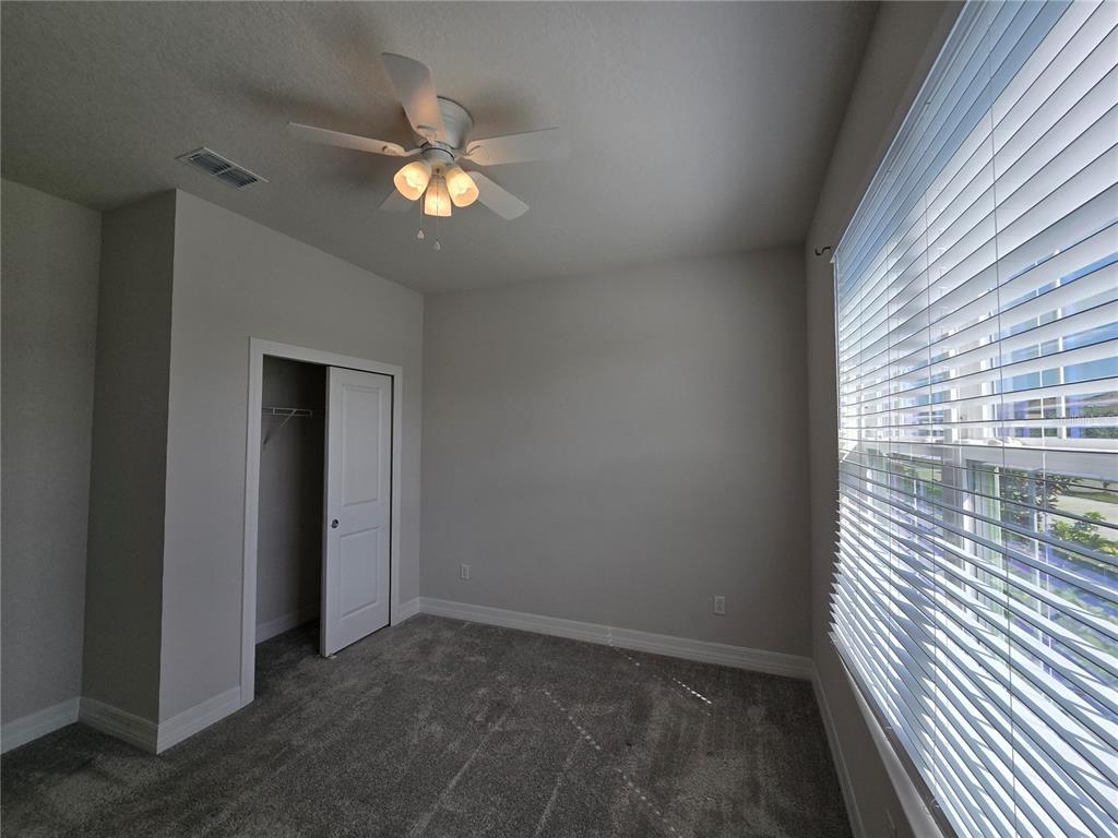 2136 Live Oak Lake Road St. Cloud, FL 34771 - Photo 32 of 42 a view of an empty room with a window