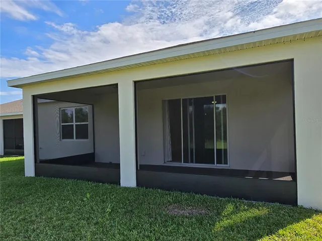 a backyard of a house with lots of green space