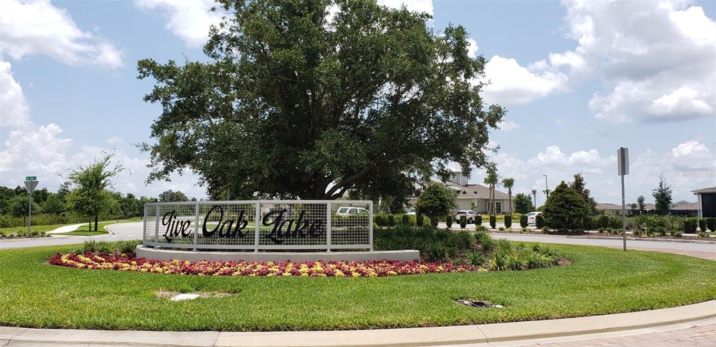 2136 Live Oak Lake Road St. Cloud, FL 34771 - Photo 39 of 42 a view of house with a big yard and large trees