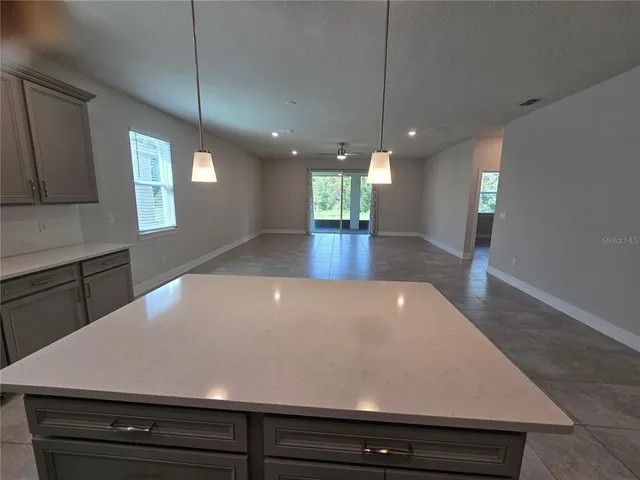 a view of kitchen and wooden floor