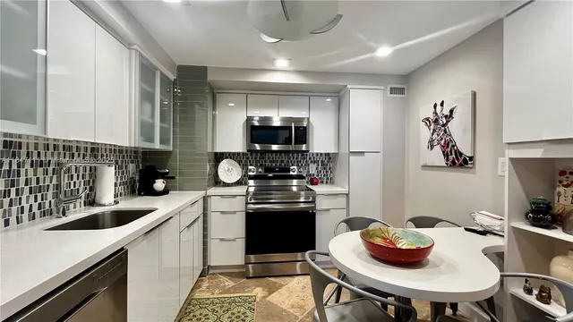 a kitchen with a sink and stove