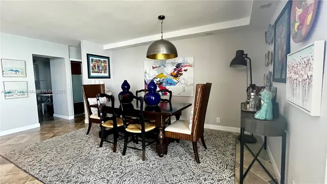 a kitchen with stainless steel appliances kitchen island granite countertop a sink and cabinets