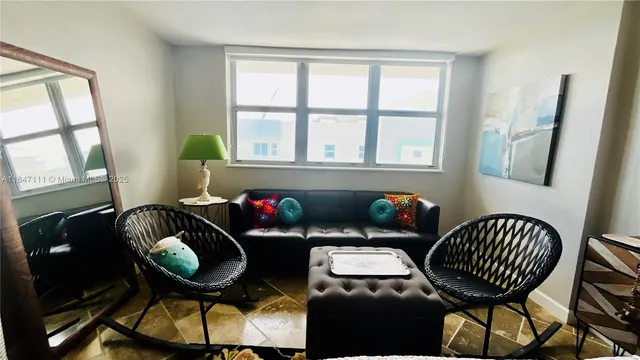 a bedroom with furniture and wooden floor