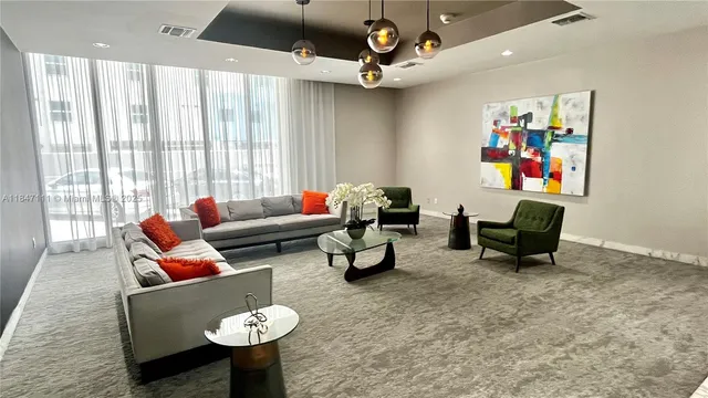 a living room with furniture and a window