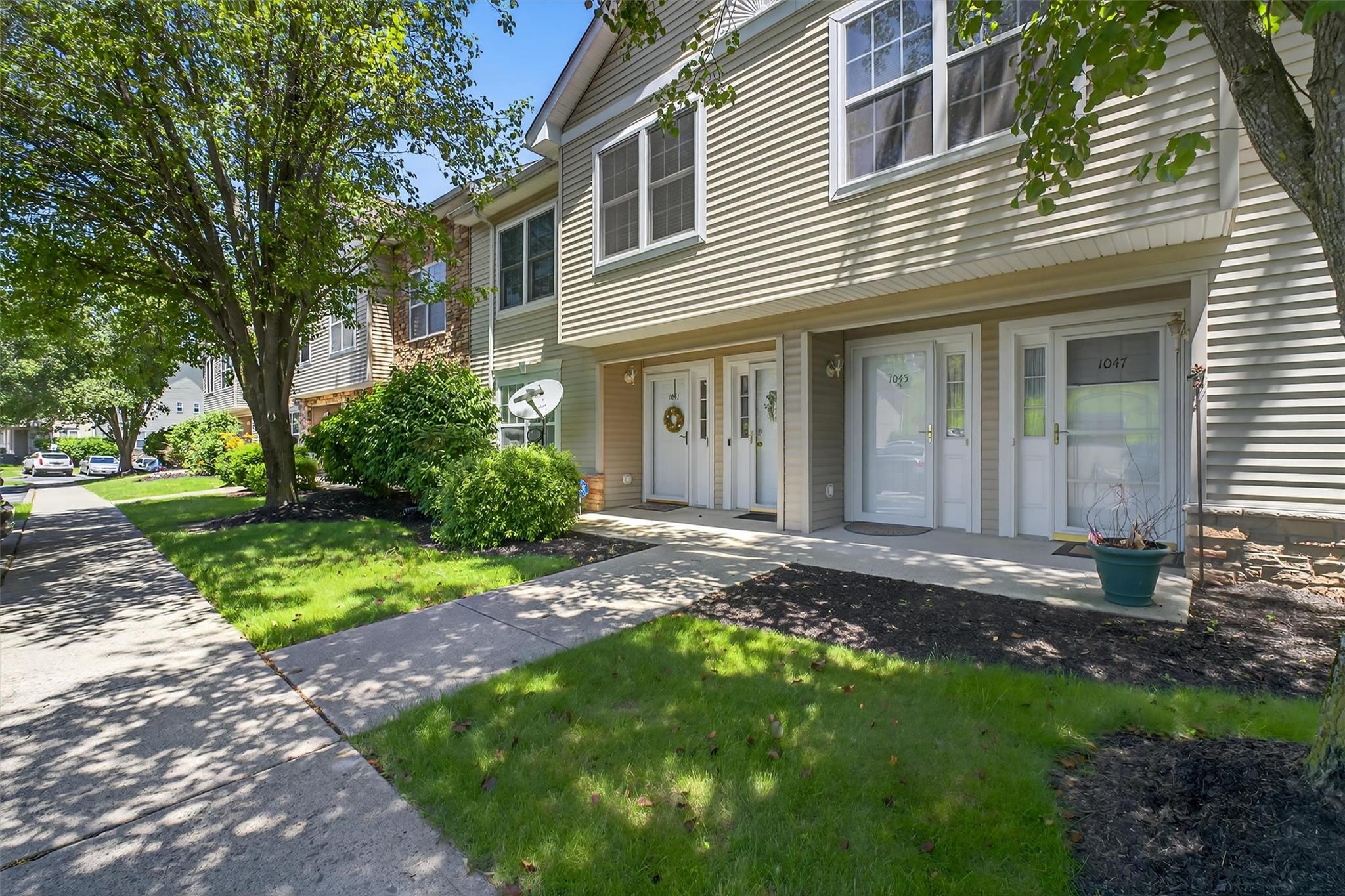 1045 Maggie Road, Unit 212 Newburgh, NY 12550 - Photo 1 of 1 View of front of house with a front lawn