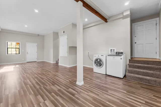 a view of a storage & utility room with empty racks
