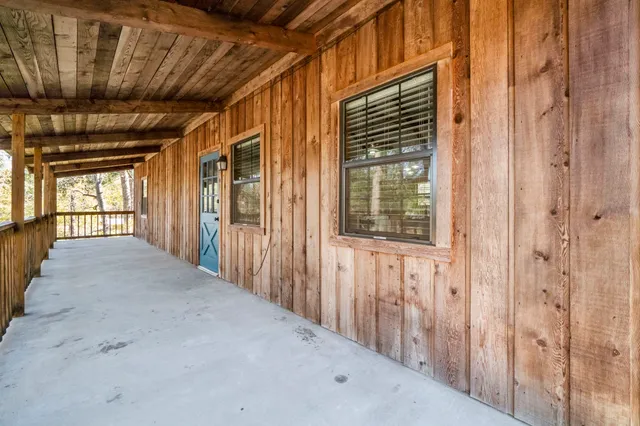 a view of a hallway with windows
