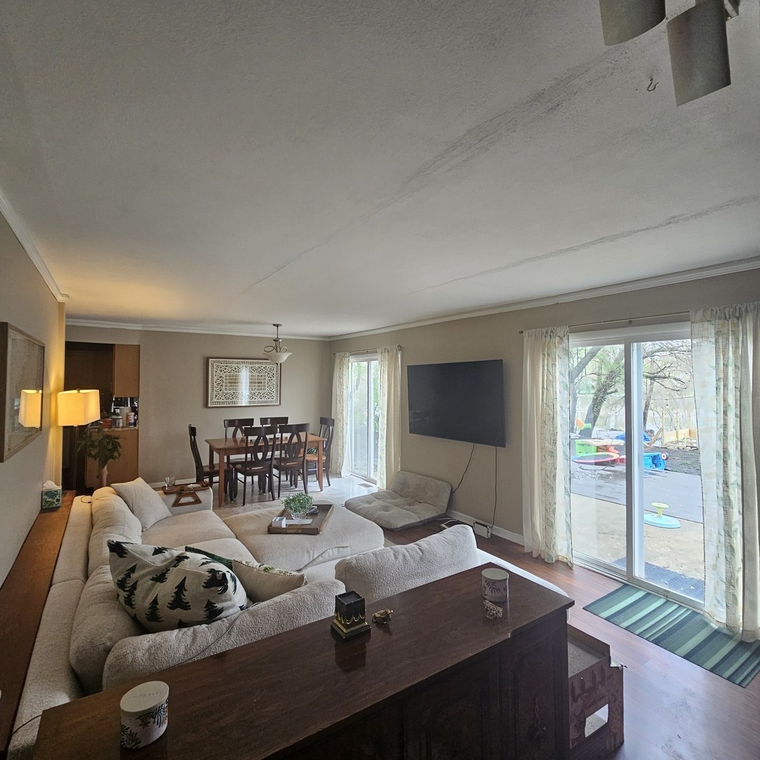 128 Essex Road Elk Grove Village, IL 60007 - Photo 4 of 18 a living room with furniture and large windows
