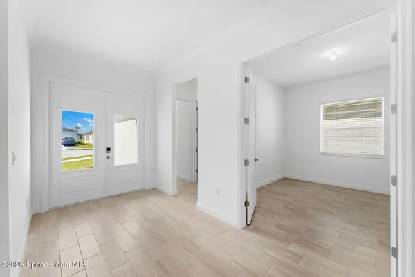 a view of kitchen with stainless steel appliances refrigerator and microwave