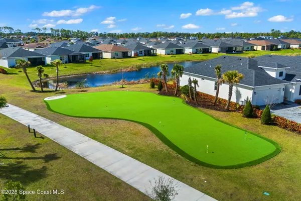 a view of a patio with a table and chairs