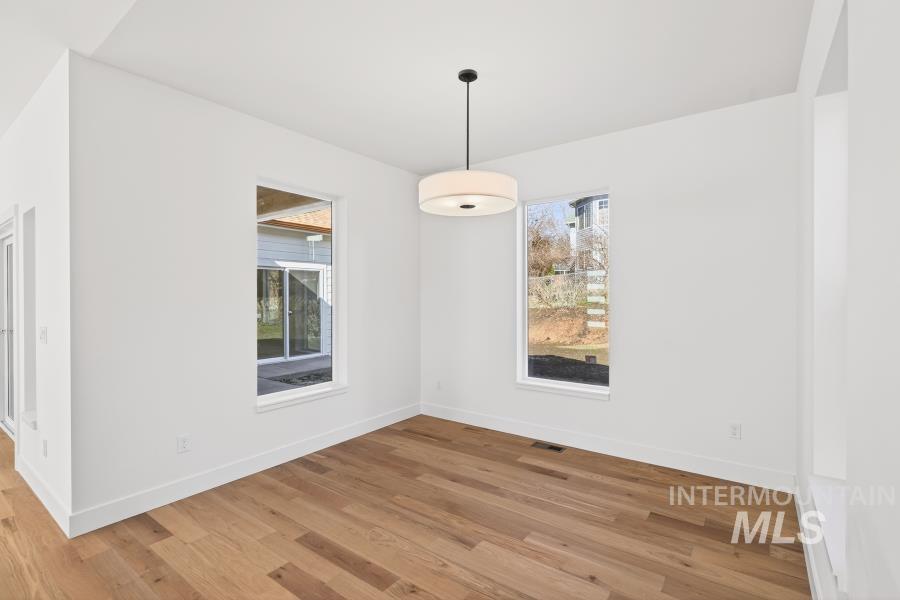 780 Victoria Drive Moscow, ID 83843 - Photo 17 of 44 Unfurnished dining area with light wood-type flooring and baseboards