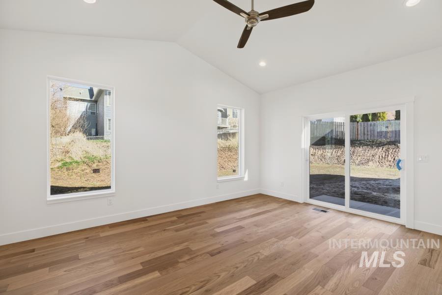 780 Victoria Drive Moscow, ID 83843 - Photo 23 of 44 Unfurnished room with recessed lighting, light wood-type flooring, a ceiling fan, and lofted ceiling