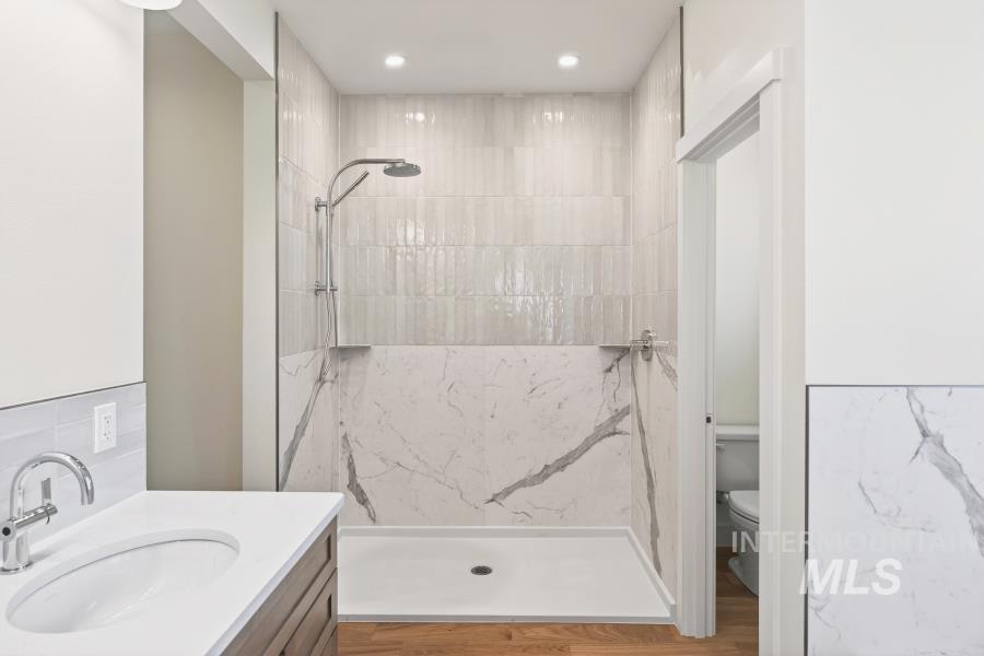 780 Victoria Drive Moscow, ID 83843 - Photo 25 of 44 Bathroom featuring vanity, a marble finish shower, and recessed lighting