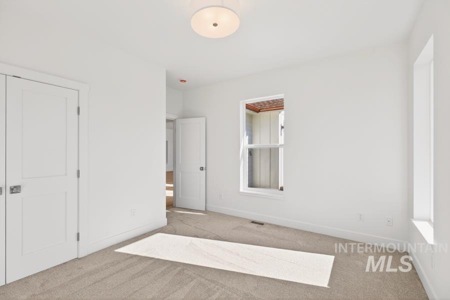 780 Victoria Drive Moscow, ID 83843 - Photo 36 of 44 Unfurnished bedroom with light carpet and baseboards