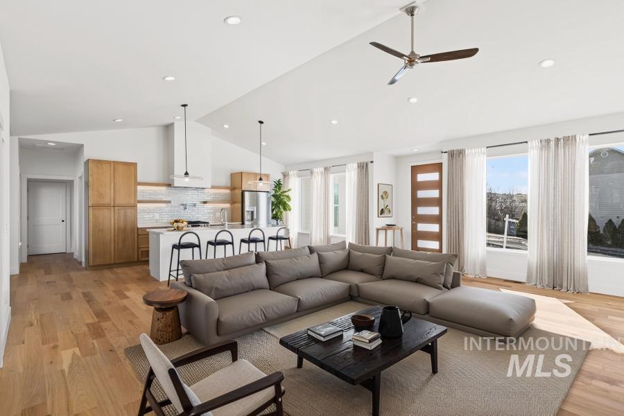 780 Victoria Drive Moscow, ID 83843 - Photo 4 of 44 Living area with light wood finished floors, lofted ceiling, ceiling fan, and recessed lighting