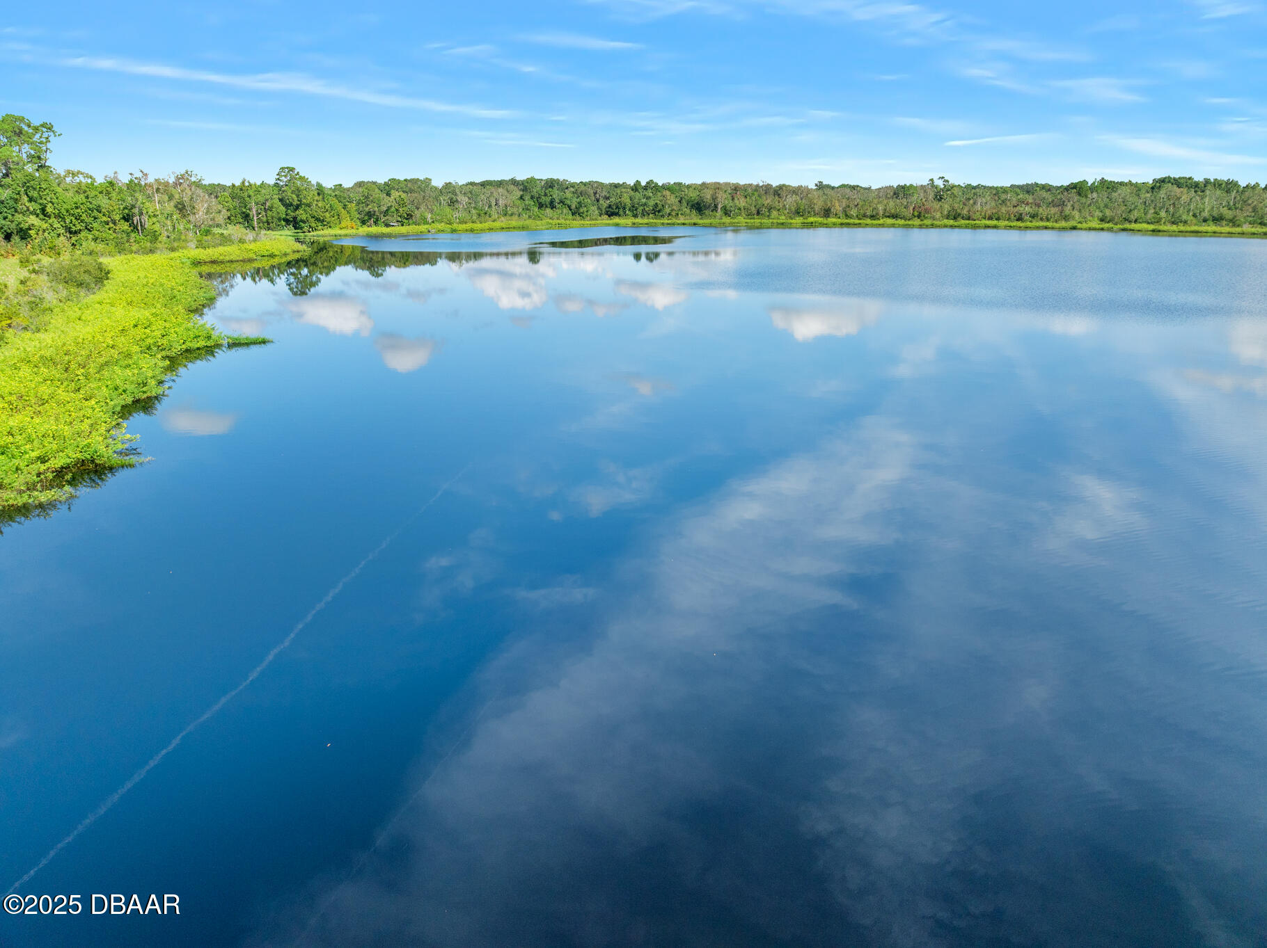 0 Roberts Road Pierson, FL 32180 - Photo 15 of 37 a view of a lake with houses in the back
