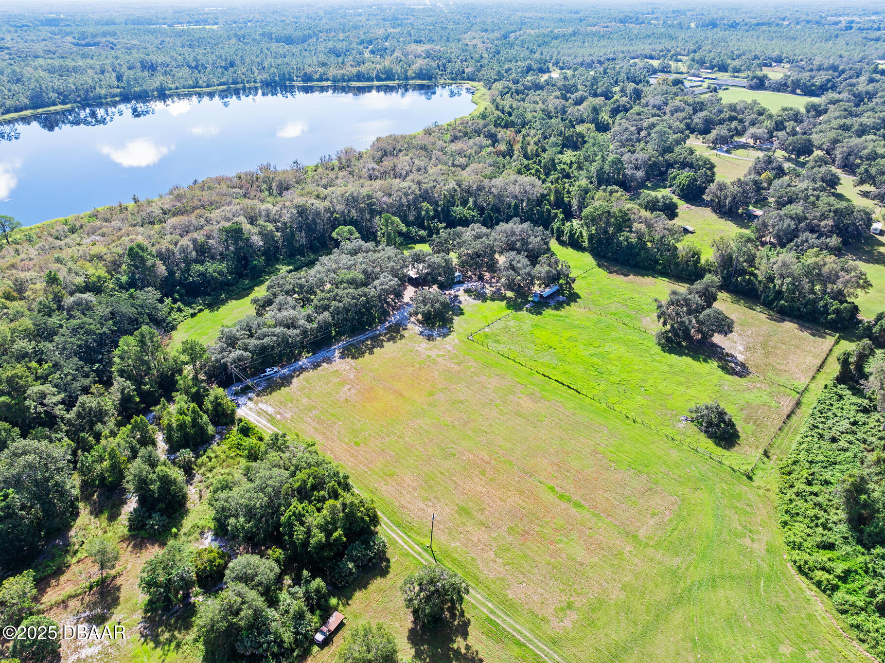 0 Roberts Road Pierson, FL 32180 - Photo 18 of 37 an aerial view of residential houses with outdoor space and lake view