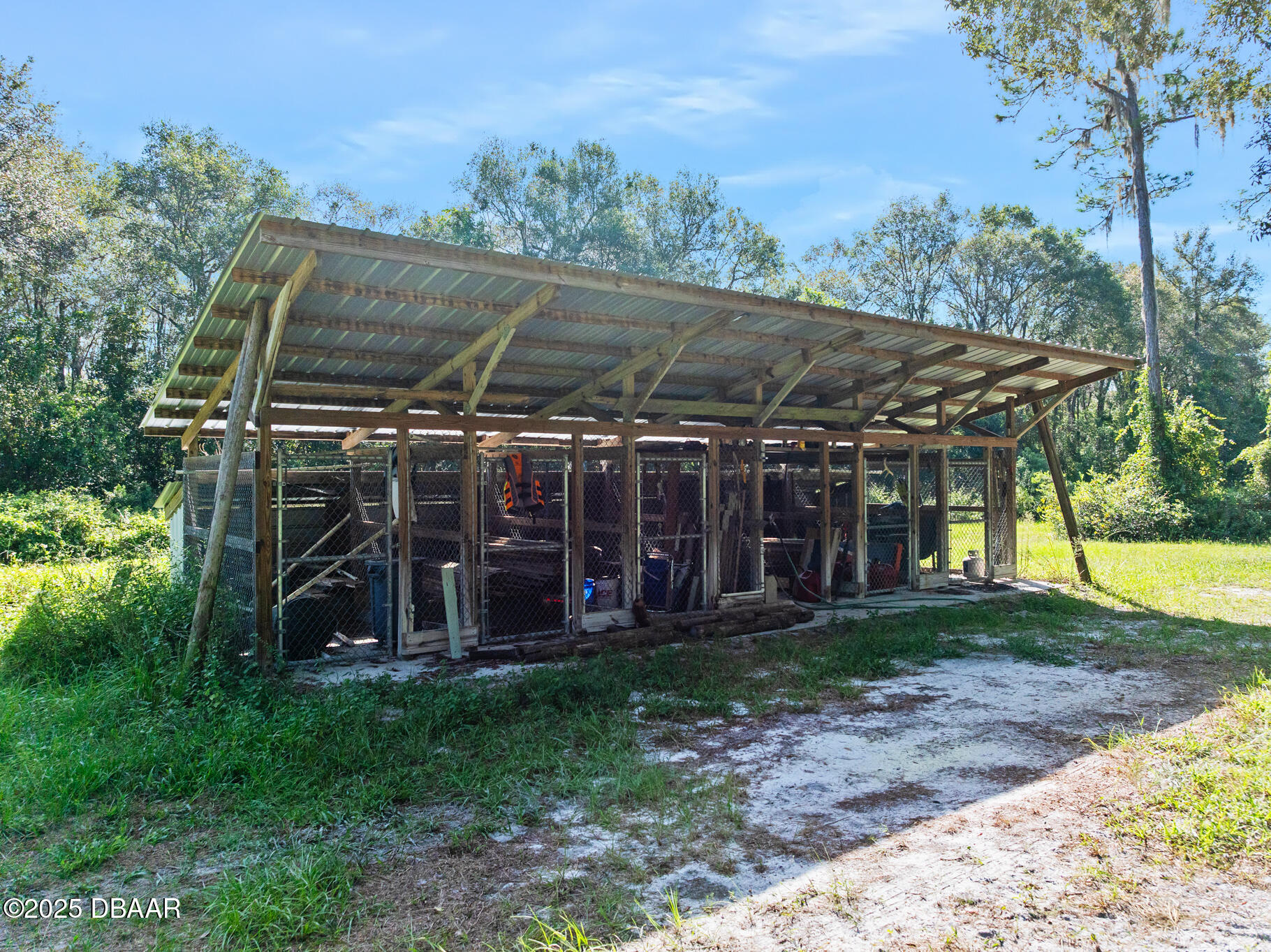 0 Roberts Road Pierson, FL 32180 - Photo 32 of 37 a view of a patio with a table and chairs under an umbrella