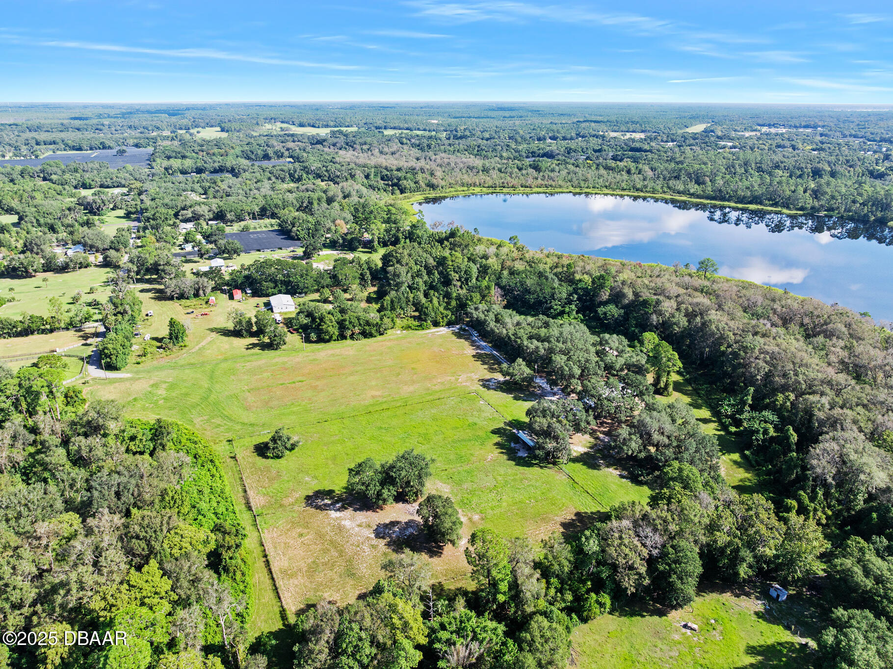 0 Roberts Road Pierson, FL 32180 - Photo 7 of 37 an aerial view of ocean with residential house and lake view