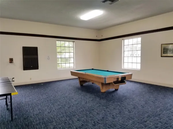 a view of a swimming pool with lounge chair