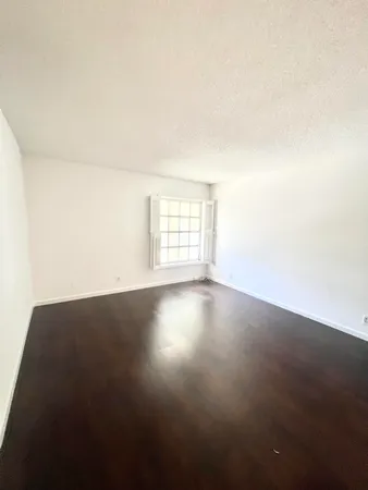 a bathroom with a double vanity sink toilet and shower