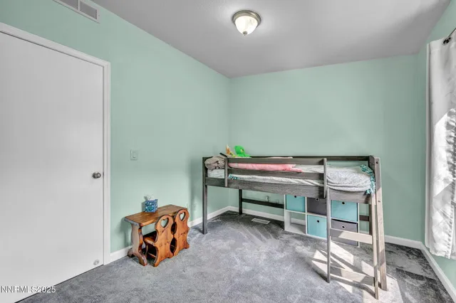 a room with a table and chairs