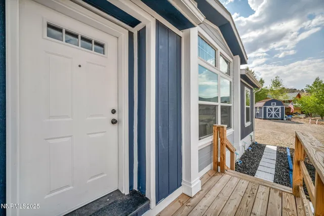 a view of outdoor space with deck and living room