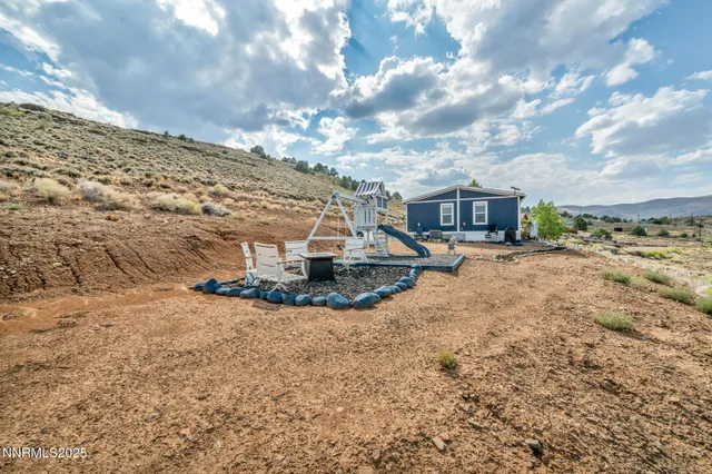 a view of a playground with a yard