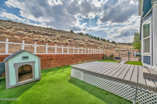 a view of a backyard with sitting area