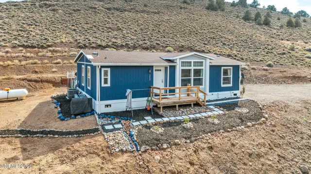 a backyard of a house with yard barbeque oven and outdoor seating