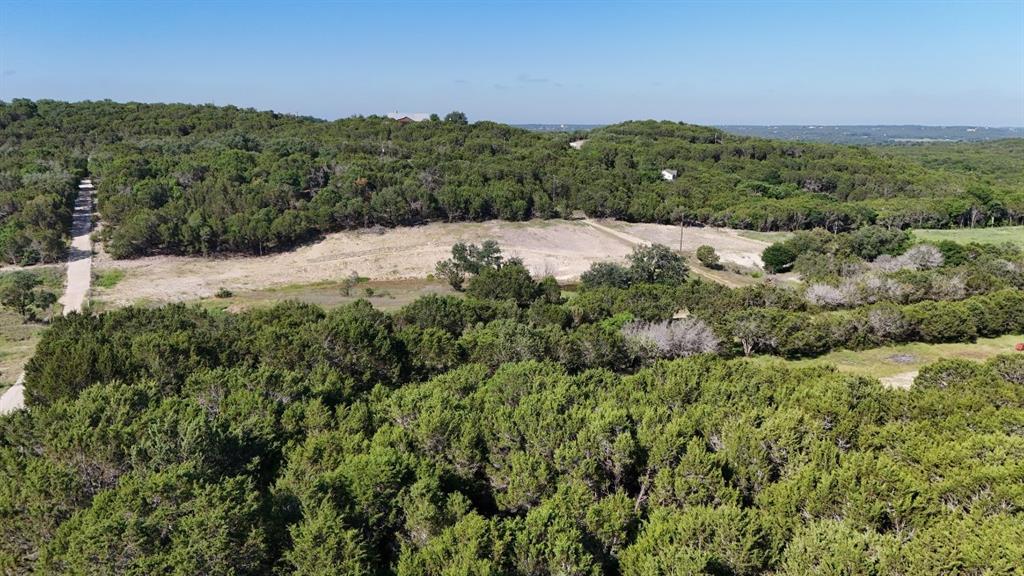 2801 Wind Point Court Tolar, TX 76476 - Photo 20 of 25 a view of a lush green field with mountains in the background