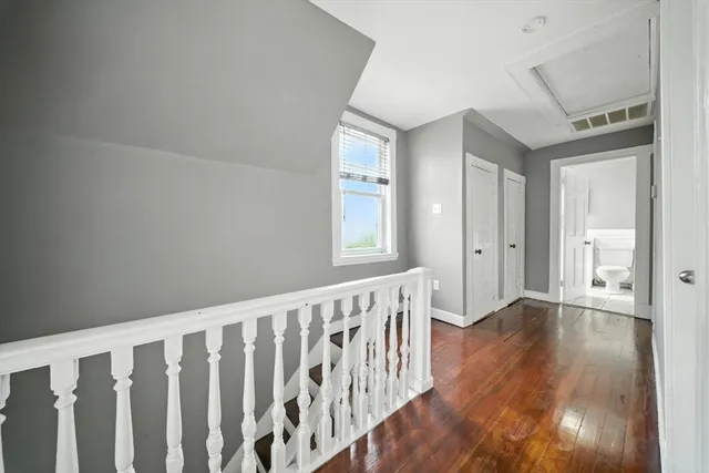 a view of an entryway with wooden floor