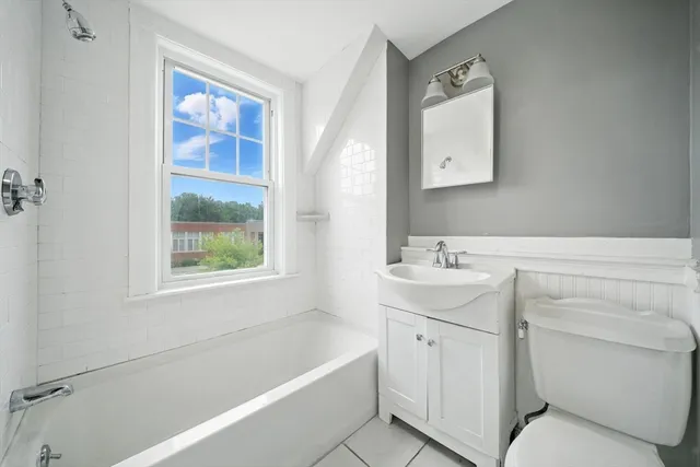 a bathroom with a toilet sink and bathtub