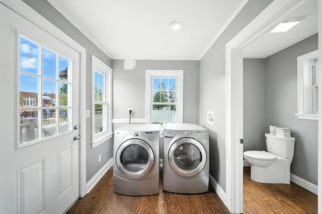a view of a bedroom with washer and dryer