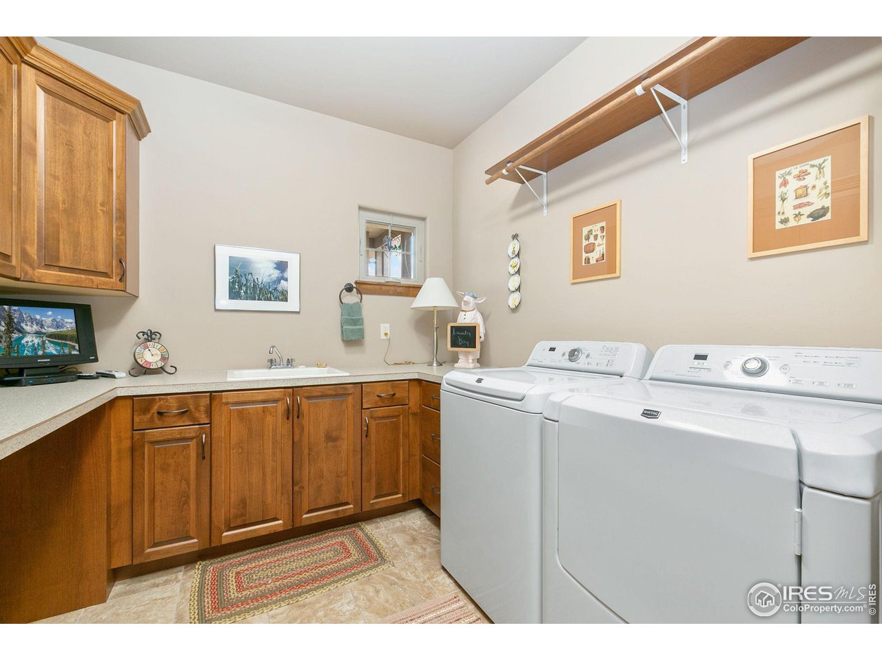 6701 Clovis Court Timnath, CO 80547 - Photo 13 of 40 a kitchen with a sink cabinets and window