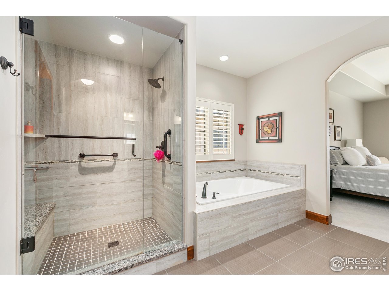6701 Clovis Court Timnath, CO 80547 - Photo 15 of 40 a bathroom with a tub a sink and a shower